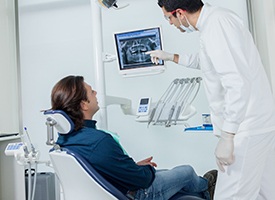 Dentist showing man his dental x-rays
