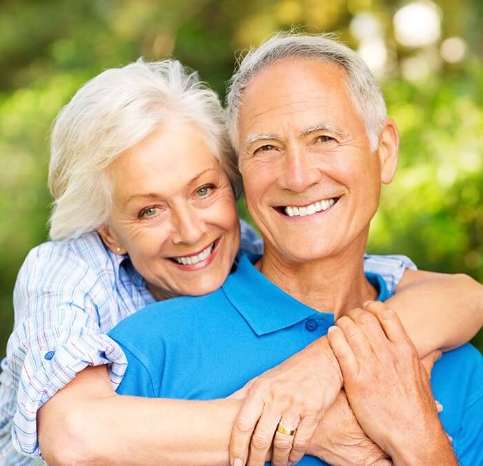 Older couple with healthy smiles